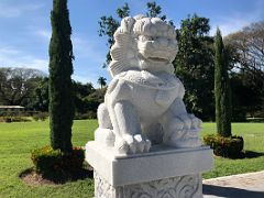 05B The female guardian lion is shown with one paw on a cub Chinese Garden Royal Botanical Hope Gardens Kingston Jamaica
